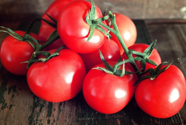 Tomatoes on wooden background