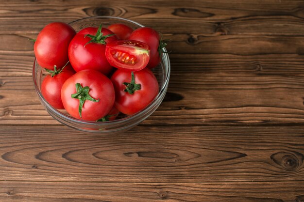 Tomatoes on wooden background