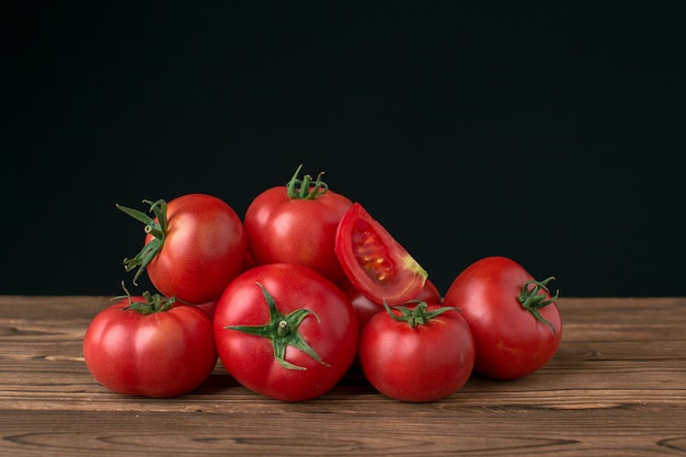 Tomatoes on wooden background