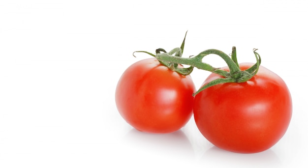 Tomatos on a white surface