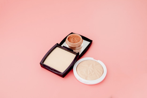 Photo tonal foundation and highlighter, base for make-up in the form of a cushion. highlighter powder cosmetic product top view