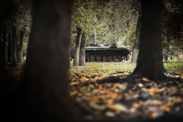 Toned photograph A selective focus shot of an abandoned military tank in forest