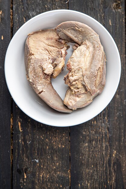 Tongue pork cooked meat boiled fresh meal snack on the table copy space food background rustic