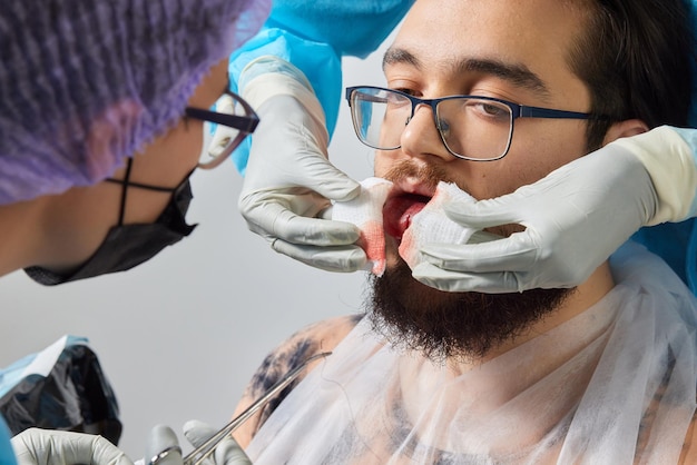 Photo tongue splitting cutting the tongue one type of modification of the human body surgery concept