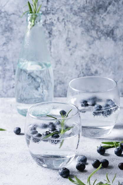 Tonic cocktail with rosemary and blueberries