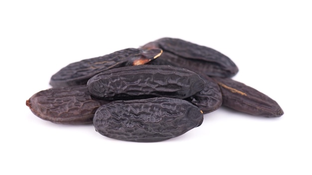 Tonka beans isolated on white background Bean of Dipteryx odorata cumaru or kumaru Fresh aroma tonka beans