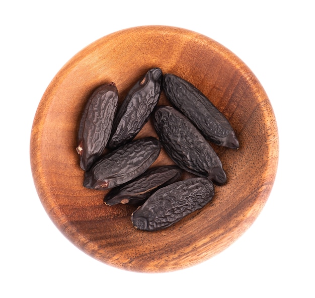 Tonka beans in wooden bowl