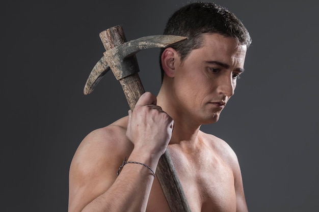 Tool, Construction worker portrait holding a peak.