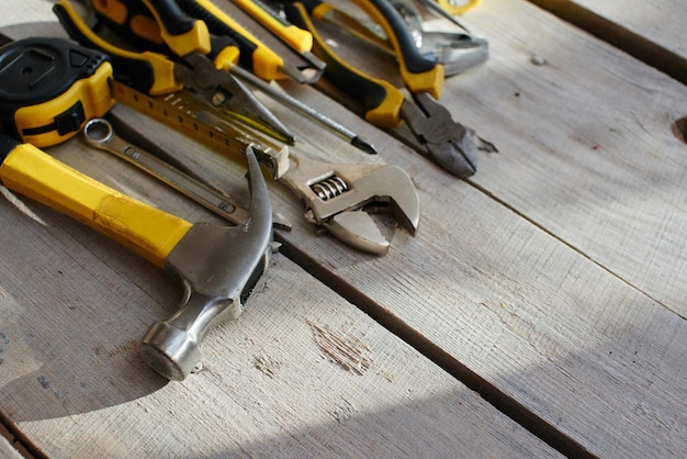 The tool kit is on the table from the wooden planks