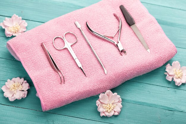 tool for manicure on pink towel studio shot