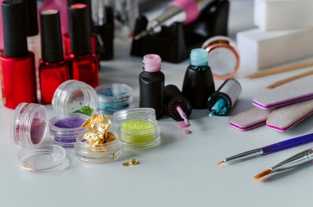 Tools and accessories for manicure gel polish on a white background