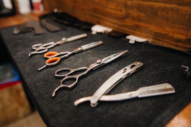 The tools of a Barber on the desktop in front of the mirror