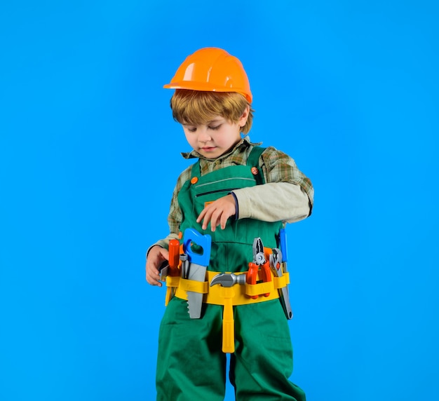 Tools for building little boy in builders uniform with tools little boy in helmet and tools kid as