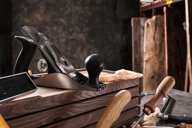 Tools of carpenter on table in workshop