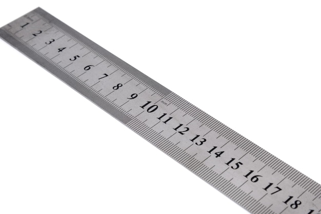 Tools collection - white metal ruler on a white background