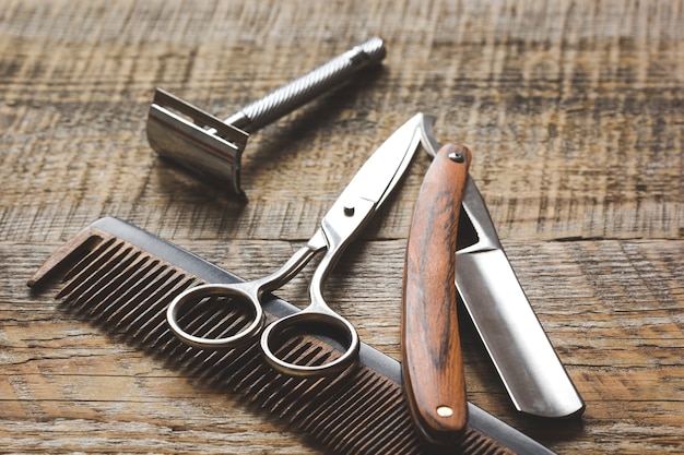 Photo tools for cutting beard barbershop on wooden background.