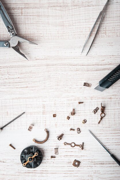 Tools and disassembled mechanism on the desktop