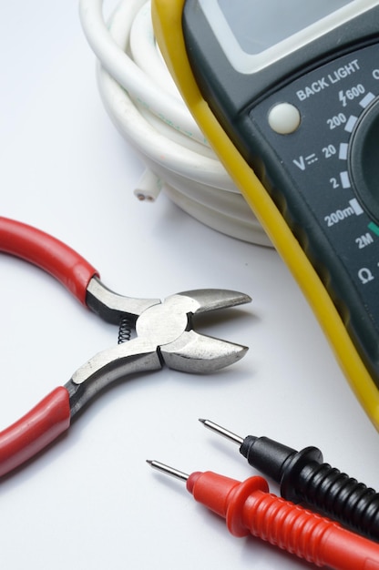 Tools for electro repair on a light background. close-up.