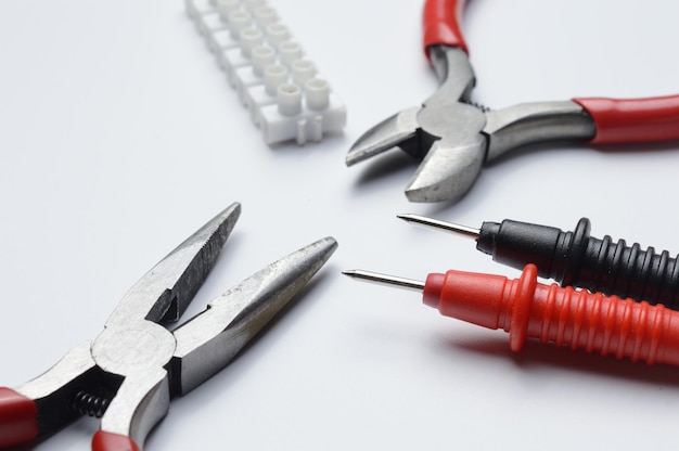 Tools for electro repair on a light background. close-up.