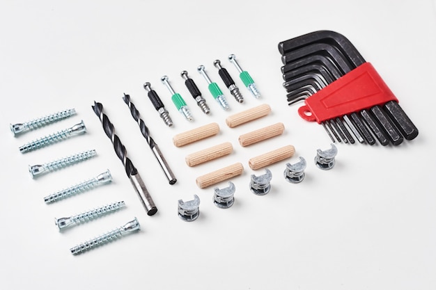 Tools for furniture assembly on a white background for mock up template design. View from above. Flat lay