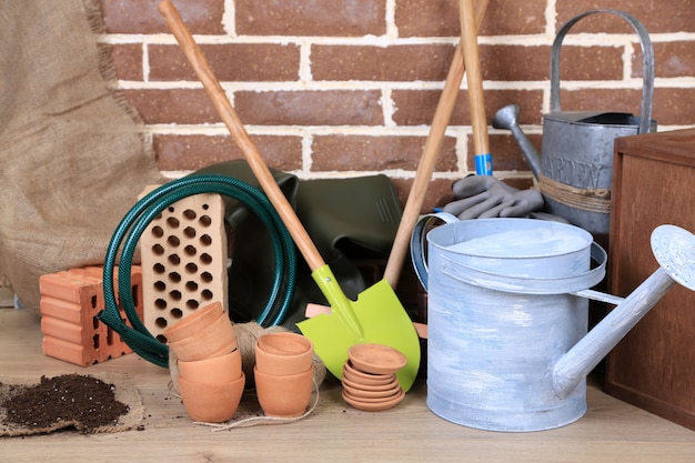 Tools of gardener on  bricks wall