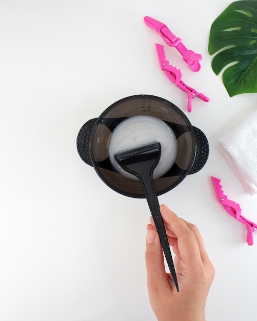 Tools for hair dye and hairdye top view white background