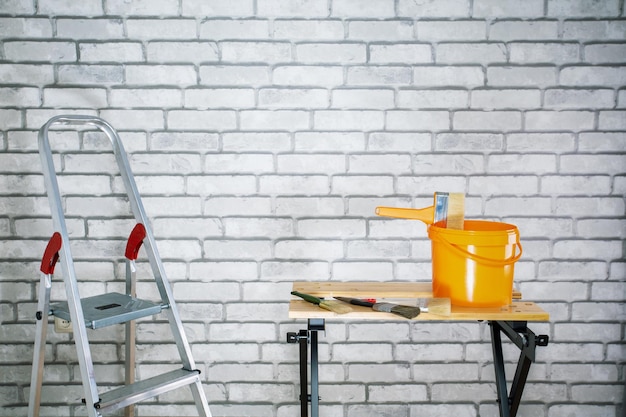 tools for home renovation on wall background with copy space home renovation concept