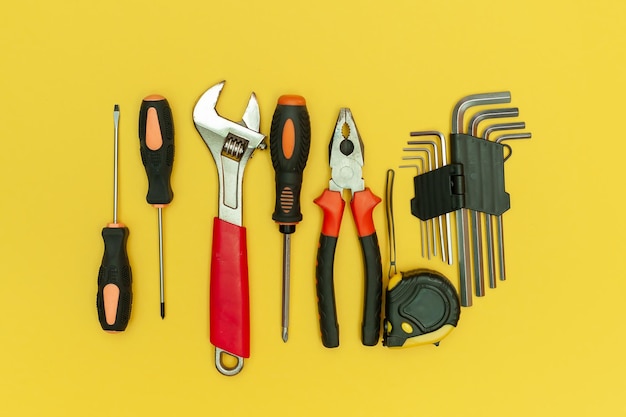 Tools on isolated yellow background