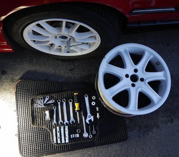 Tools kit for installation of car wheels near car on service station