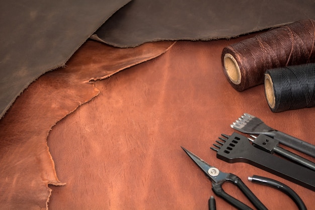 Tools For Leather Crafting And Pieces Of Brown Leather Manufacture Of  Leather Stock Photo - Download Image Now - iStock