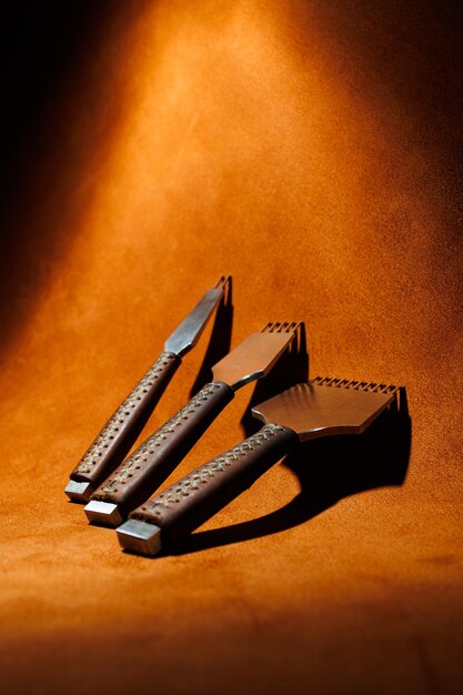 Tools for making leather goods and pieces of brown leather Production of leather products View from above