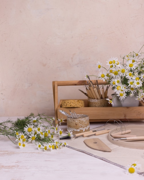 tools for making pottery on a wooden table