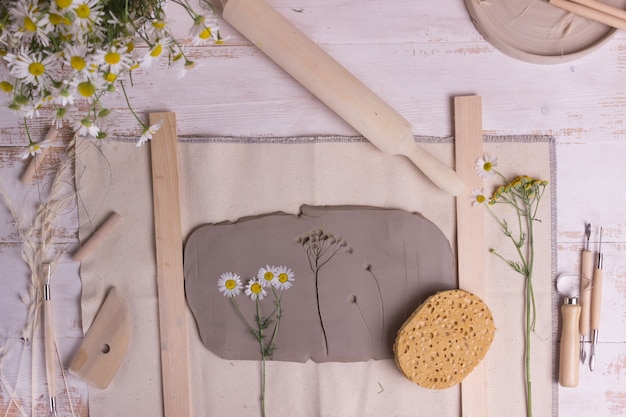 tools for making pottery on a wooden table