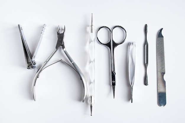 Tools for manicure and nail care on a white background.