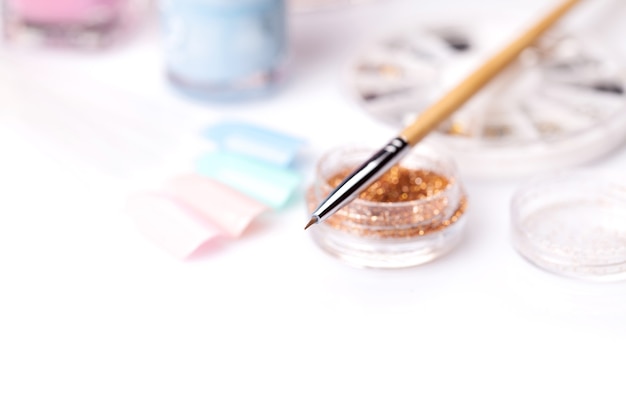 Tools of a manicure set on a white surface