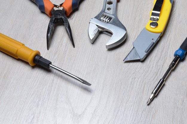 Tools for minor home repairs are on the countertop. view from above.