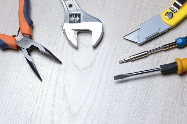 Tools for minor home repairs are on the countertop. view from above.