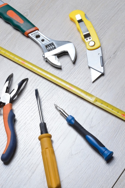 Tools for minor home repairs are on the countertop. view from above.