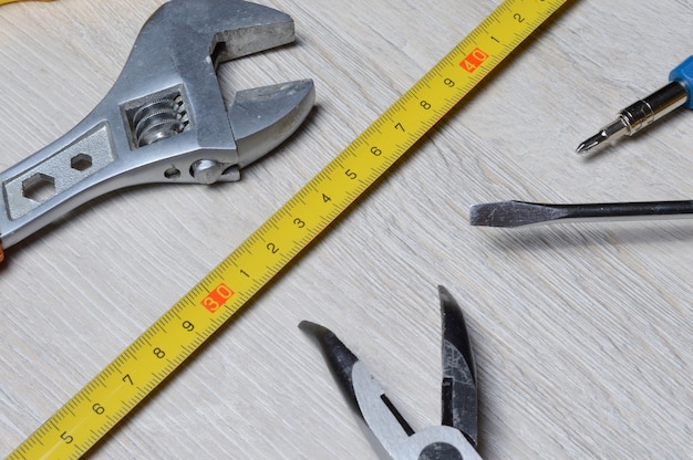 Tools for minor home repairs are on the countertop. view from above.