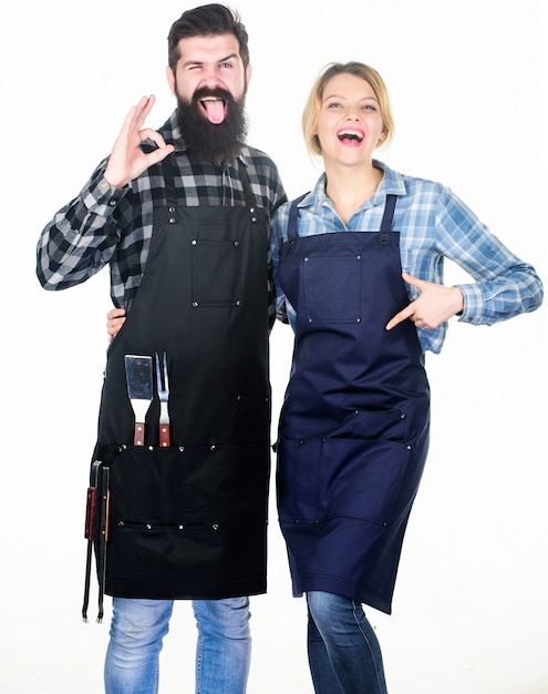 Tools for roasting meat. Couple in love hold kitchen utensils. Man bearded hipster and girl. Preparation and culinary. Picnic barbecue. food cooking recipe. Family weekend. So yummy.