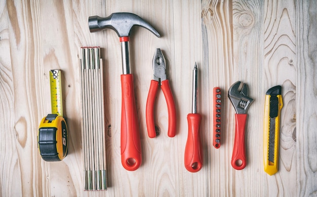 Tools set on wooden table top view