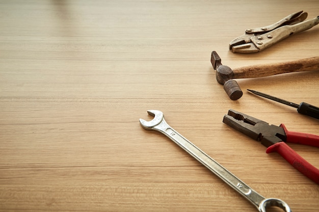 tools supplier on wood background