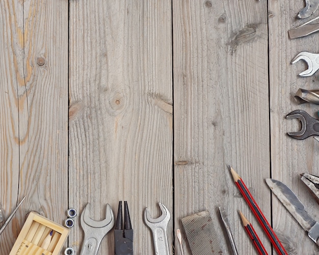  Tools on a wooden floor, top view.