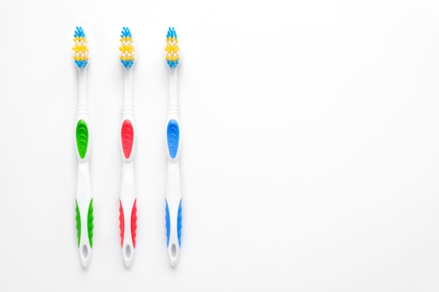 Tooth brushes on white copy space