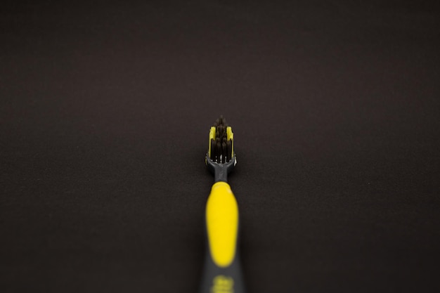 Toothbrush on a black background minimalism