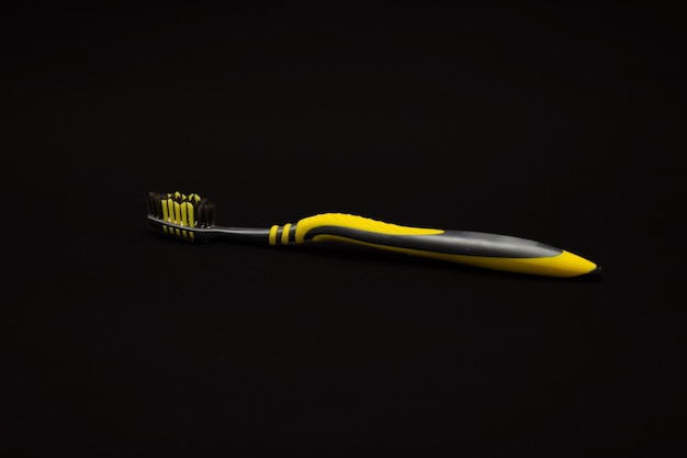 Toothbrush on a black background minimalism