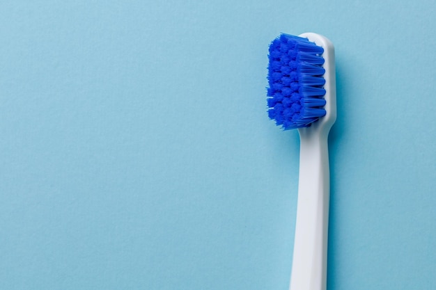 Toothbrush closeup on a blue background