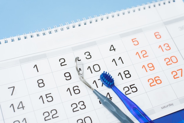 Toothbrush and dental instrument on a calendar