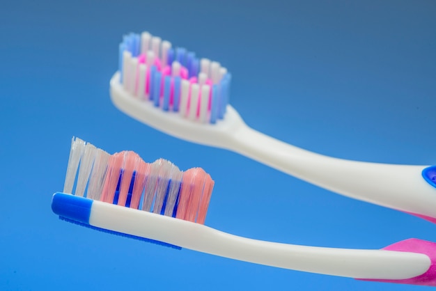 Toothbrush heads on blue background