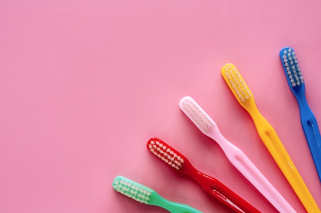 Toothbrush used for cleaning the teeth on pink background